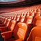 Soccer anticipation Empty orange seats await fans at stadium rows