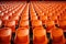 Soccer anticipation Empty orange seats await fans at stadium rows