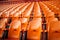 Soccer anticipation Empty orange seats await fans at stadium rows