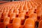 Soccer anticipation Empty orange seats await fans at stadium rows