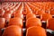 Soccer anticipation Empty orange seats await fans at stadium rows