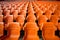 Soccer anticipation Empty orange seats await fans at stadium rows