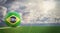 Soccer ball in Brazils national flag design on a soccer field