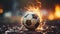 A soccer ball engulfed in flames on a football field
