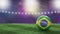 Soccer ball in flag colors on a bright blurred stadium background. Brazil.