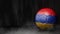 Soccer ball in flag colors on a dark abstract background. Armenia.