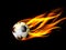 Soccer ball in flames on black background, burning soccer ball