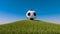 Soccer ball on a grassy hill. 3d render