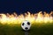 Soccer ball on the lawn of the stadium with fire effect