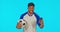 Soccer ball, man and celebration with phone in studio isolated on a blue background mockup. Football, face and excited