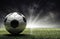 A soccer ball is placed on a grassy field