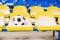 Soccer ball placed on snowy seats on stadium