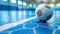 A soccer ball rests on a glossy blue indoor court with natural light.