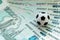 A soccer ball on Russian banknotes with a face value of one thousand rubles. Close-up. The concept of corruption, bribes or sports