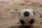 Soccer ball on sand