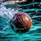 Soccer ball is in water and being kicked by someone. The person appears to be wearing blue shirt while playing with