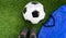 Soccer concept : Football & x28;soccer ball& x29;, old soccer boots, blue