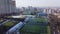 Soccer field covered with water from melting snow, aerial view