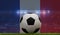 Soccer football ball on a grass pitch in front of stadium lights and france flag. 3D Rendering