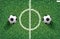 Soccer football ball on green grass of soccer field with center line area. Vector