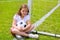 Soccer football kid girl relaxed on grass with ball