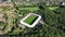 Soccer football stadium top down overhead Aerial in forrest park. Green grass landmark landscape architecture structure