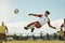 Soccer, game and man kicking a ball during training with the team on a field for sports. Athlete football player in the