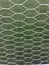 Soccer goal net against green background