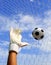 Soccer goalkeeper\'s hands reaching for the ball