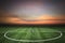 Soccer green grass field at sunset