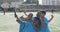 Soccer kids in blue taking a selfie and laughing in a sunny day