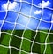 Soccer net against the sky and field