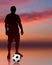 Soccer Player on Evening Background