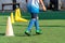 Soccer player feet training with marker in soccer academy field