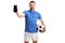 Soccer player holding a football and a mobile phone