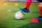 Soccer player jump and stomp for trap and control football with