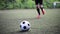 Soccer player playing with ball on field