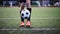 Soccer player playing with ball on field