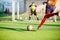 Soccer player run to shoot ball at penalty kick to goal with blurry goalkeeper background