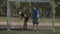 Soccer player scoring a goal during football match