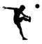 Soccer player silhouette kick the ball.