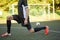 Soccer player stretching leg on field football