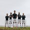 Soccer players standing on the field during practice