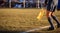 Soccer referee assistant moves at sideline with flag at hands. Blur green field,nature backdrop, close up view, banner, space.