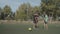 Soccer referee pointing at penalty spot during game