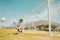 Soccer, sports and children with a goalkeeper saving a shot during a competitive game on a grass pitch or field