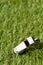 Soccer sports chrome whistle on grass background - penalty, foul or sports concept