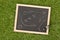 Soccer sports referee chrome whistle with game strategy drawing blackboard on grass background - top view flat lay from above