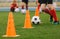 Soccer Training Drill. Football Player Running With Ball. Soccer Athletes Participate in Soccer Practice Drills