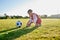 Soccer, training and tie shoes with girl in sports workout for motivation, health and wellness. Exercise, growth and